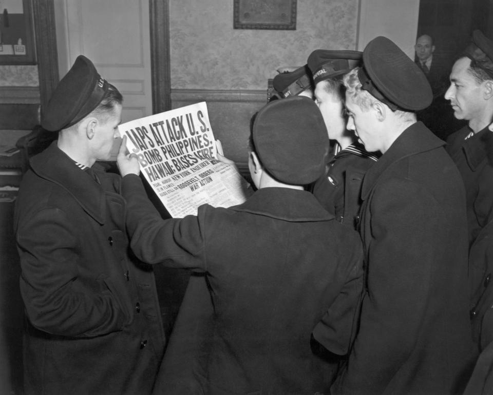 Sailors read about Pearl Harbor attak