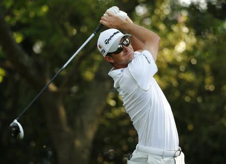 Justin Rose of Britain hits a driver off the second tee during first round play of the Masters golf tournament at the Augusta National Golf Course in Augusta, Georgia April 9, 2015. REUTERS/Mark Blinch