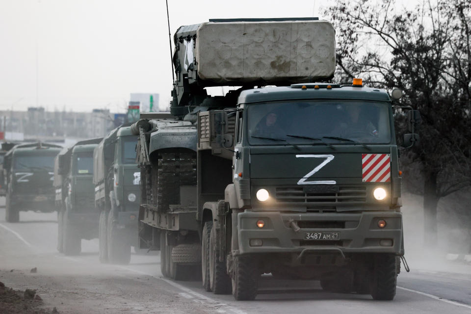 CRIMEA, RUSSIA - FEBRUARY 24, 2022: A column of army trucks moves across the town of Armyansk, northern Crimea. Early on February 24, President Putin announced a special military operation to be conducted by the Russian Armed Forces in response to appeals for help from the leaders of the Donetsk and Lugansk People's Republics. Sergei Malgavko/TASS (Photo by Sergei Malgavko\TASS via Getty Images)