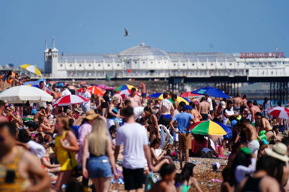 People enjoy the hot weather in Brighton (Victoria Jones/PA) (PA Wire)