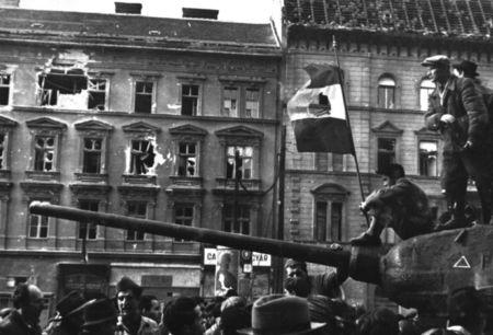 Fighters sit on top of a tank with a revolutionary flag in Budapest at the time of the uprising against the Soviet-supported Hungarian communist regime in 1956. The picture was taken in the period between October 23 and November 4, 1956. REUTERS/Laszlo Almasi /File Photo