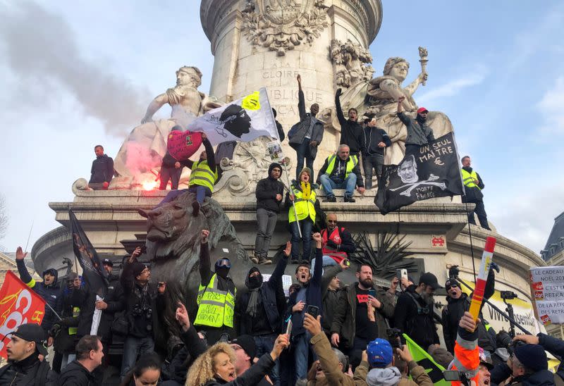 French labour union members and workers on strike attend a demonstration in Paris