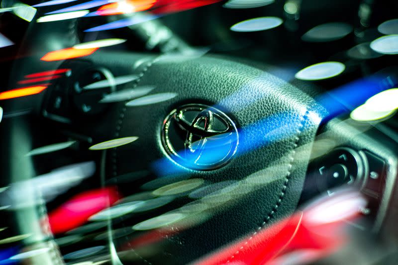 FILE PHOTO: The logo of Toyota Motor is seen on a steering wheel inside a Vios model