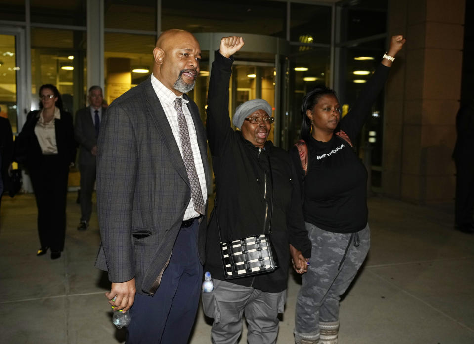 Sheneen McClain, center, is flanked by Omar Montgomery, left, president of the Aurora NAACP, and Midian Holmes outside the Adams County Colo., Justice Center after verdicts were rendered, Friday, Dec. 22, 2023, in Brighton, Colo. Two paramedics were convicted in the 2019 killing of McClain's son Elijah McClain, who they injected with an overdose of the sedative ketamine after police put him in a neck hold. (AP Photo/David Zalubowski)