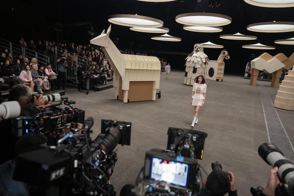 A model wears a creation as part of the Chanel Haute Couture Spring-Summer 2023 collection presented in Paris, Tuesday, Jan. 24, 2023. (AP Photo/Thibault Camus)