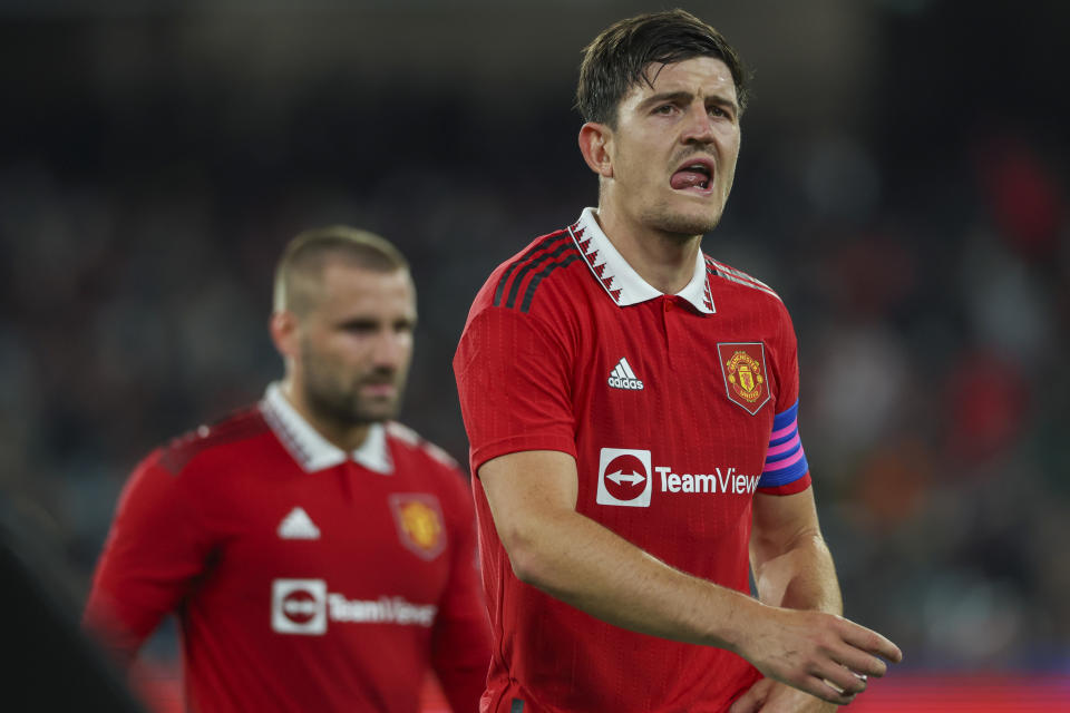 Manchester United's Harry Maguire reacts as he leaves the pitch at halftime during the soccer match between Manchester United and Melbourne Victory at the Melbourne Cricket Ground, Australia, Friday, July 15, 2022. (AP Photo/Asanka Brendon Ratnayake)