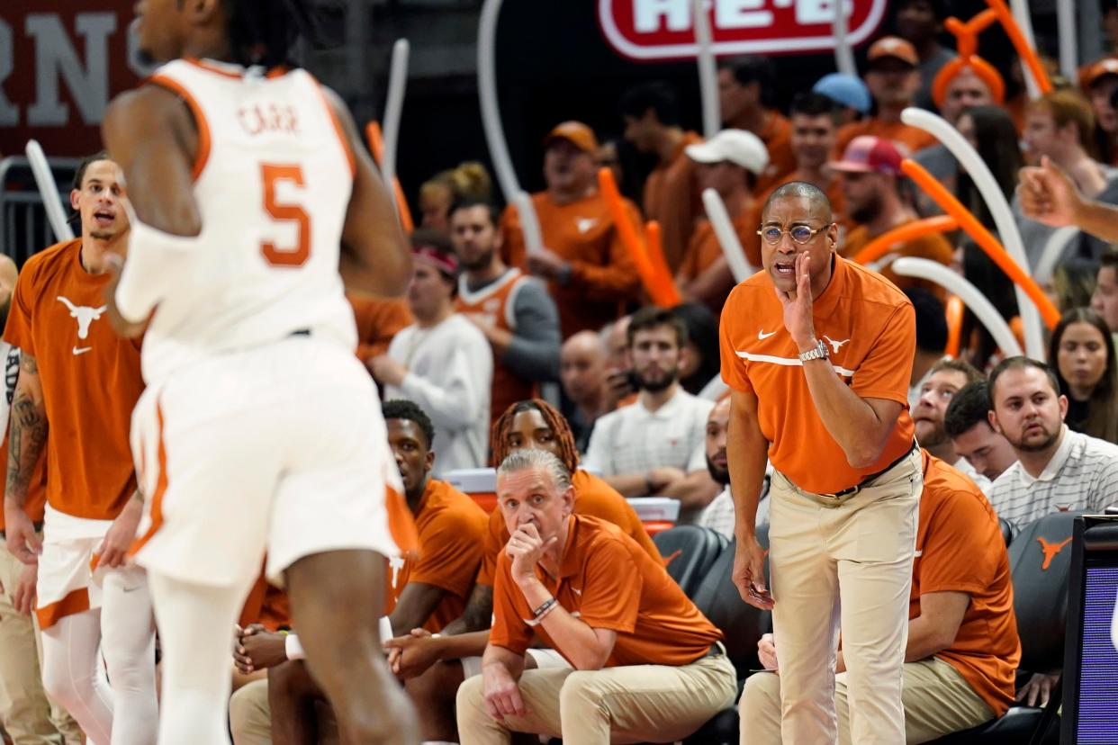 Acting Texas head coach Rodney Terry directs instructions toward Longhorns guard Marcus Carr during Monday night's 87-81 overtime win over Rice. Terry was coaching in place of Chris Beard, who has been suspended indefinitely after his early morning arrest Monday.