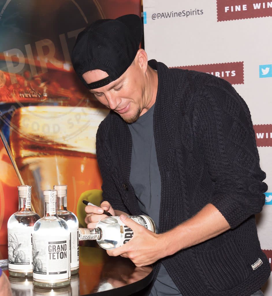 Channing Tatum signs bottles of Born And Bred Vodka