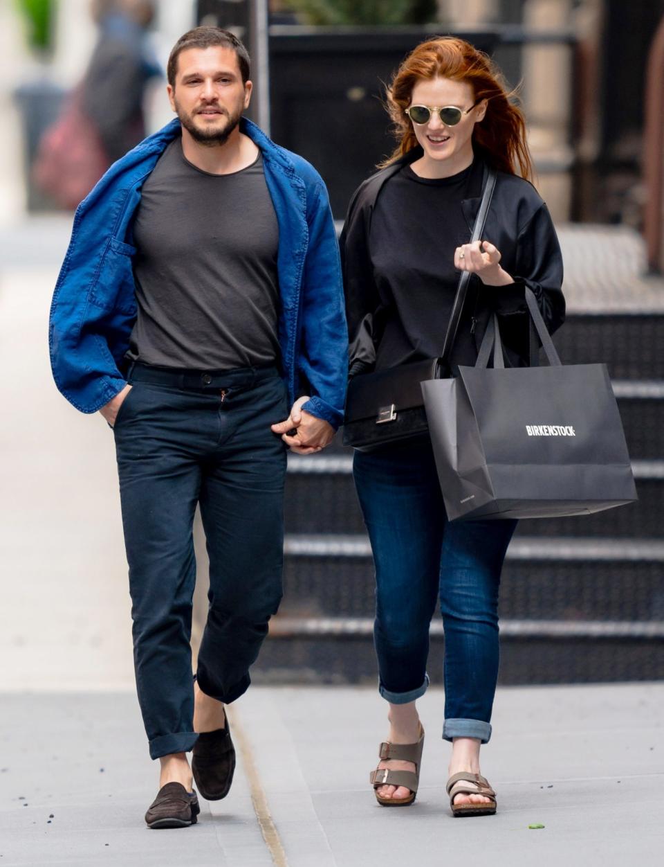 <p>Kit Harington and Rose Leslie hold hands while out shopping in N.Y.C. on Friday. </p>