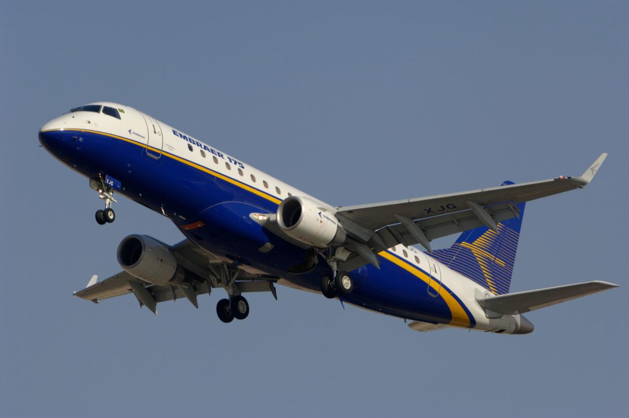 Prototype aircraft, an Embraer 175 in a flypast with undercarriage down.