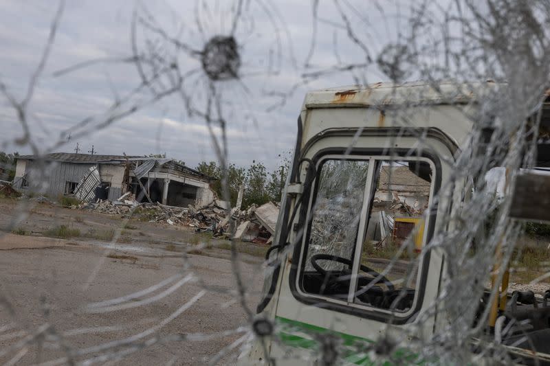 Damaged buses and production facilities are seen at a compound of a local enterprise, which was used by Russian troops as a hosting place during occupation of the Balakliia town