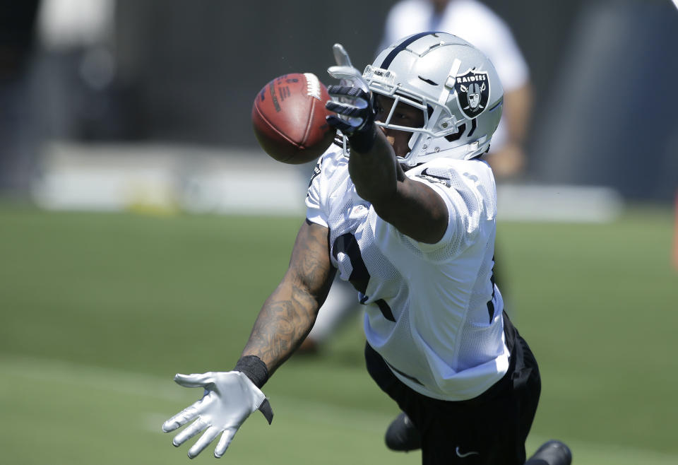 Oakland Raiders wide receiver Martavis Bryant leaps for a pass at the NFL football team’s minicamp Wednesday, June 13, 2018, in Alameda, Calif. (AP Photo/Rich Pedroncelli)