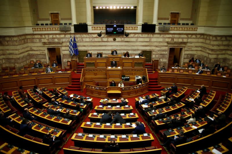 Greek PM Kyriakos Mitsotakis addresses lawmakers on his government's handling of the coronavirus disease (COVID-19) pandemic