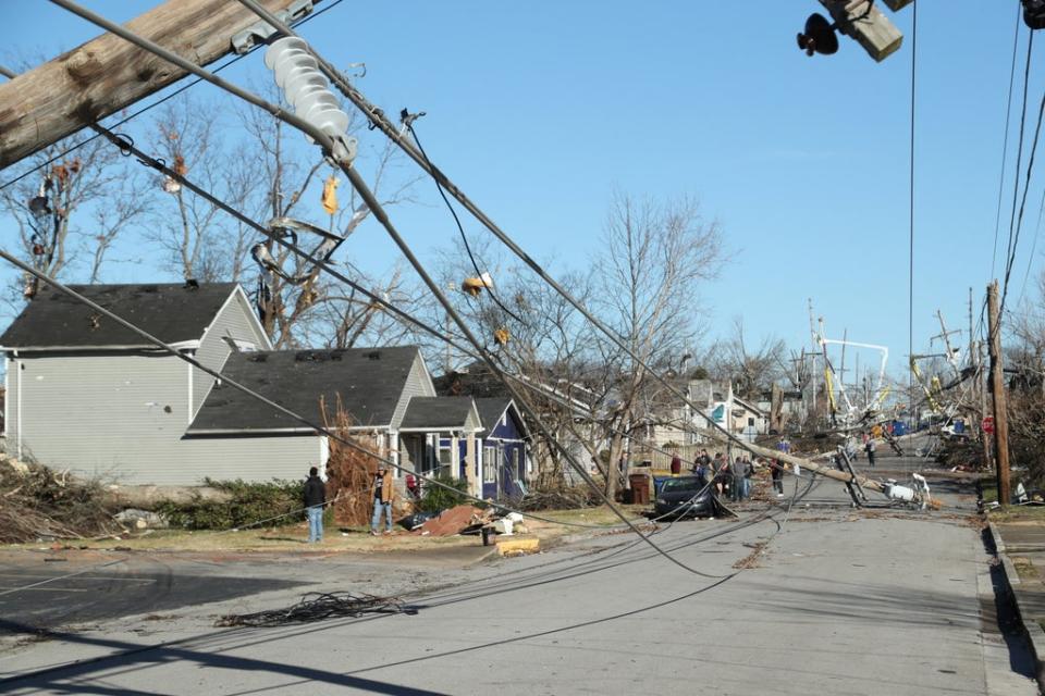 Power lines in the middle of the street after tornadoes ripped through town (Reuters)