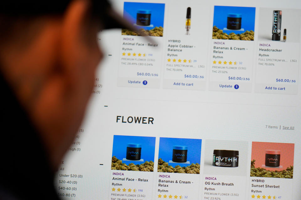 Customers place orders for cannabis products on a tablet at a RISE dispensary in Bloomfield, N.J., on April 21.<span class="copyright">Seth Wenig—AP</span>