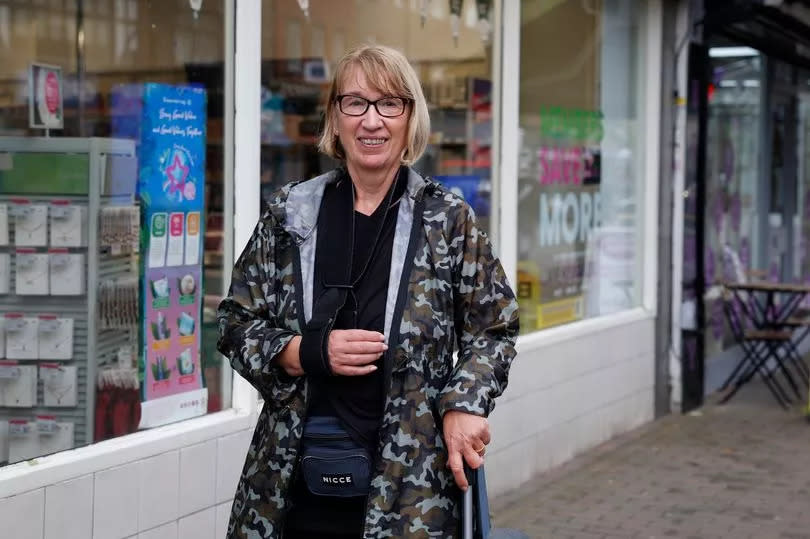 Julie Scott pictured in Orpington High Street with her arm in a sling