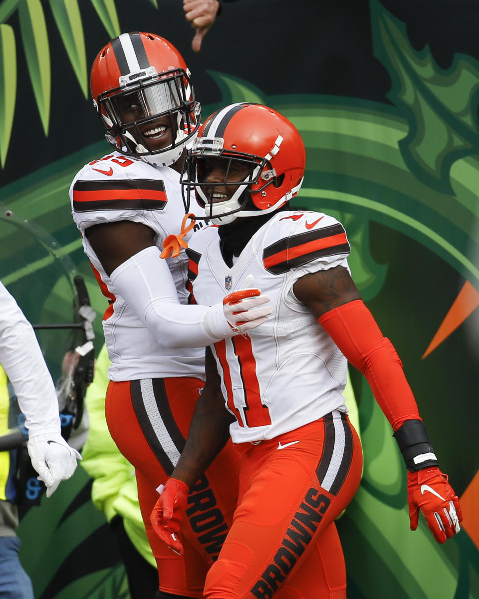 Cleveland Browns wide receiver Antonio Callaway (11) celebrates his touchdown with tight end David Njoku, left, in the first half of an NFL football game against the Cincinnati Bengals, Sunday, Nov. 25, 2018, in Cincinnati. (AP Photo/Frank Victores)