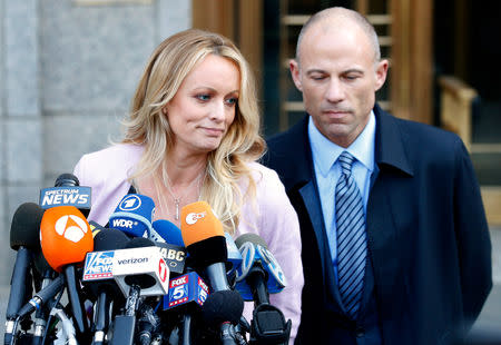 FILE PHOTO: Adult film actress Stephanie Clifford, also known as Stormy Daniels, speaks to media along with lawyer Michael Avenatti (R) outside federal court in the Manhattan borough of New York City, New York, U.S., April 16, 2018. REUTERS/Brendan Mcdermid/File Photo