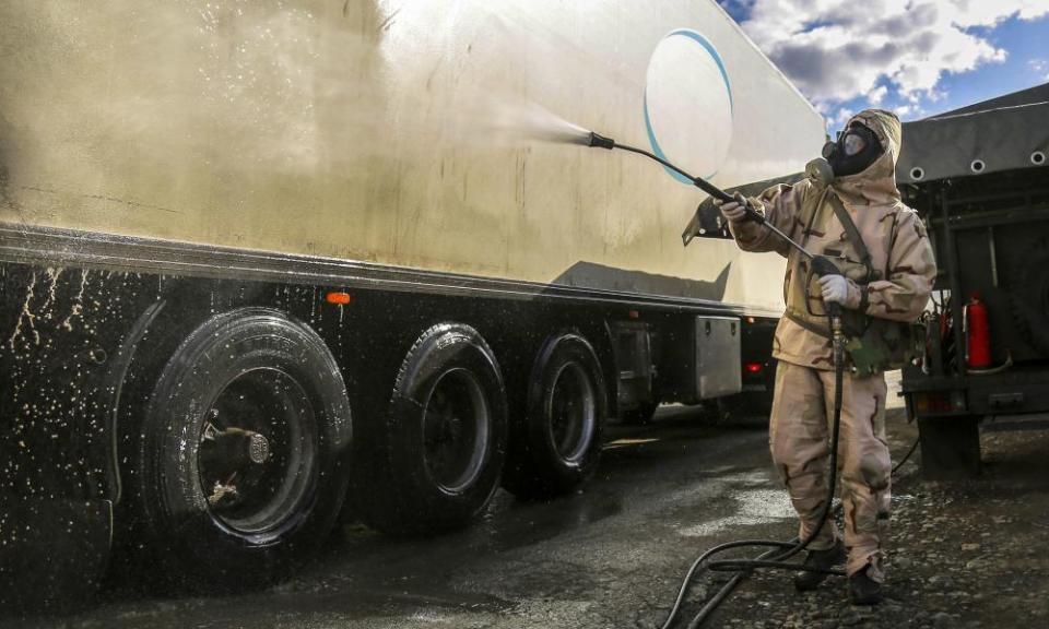 A Revolutionary Guard member disinfects a truck to help prevent the spread of the new coronavirus in the city of Sanandaj, western Iran.