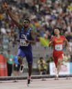 Noah Lyles of the United States leads the team to gold in the men's 4x100 meter relay final at the World Athletics Championships in Doha, Qatar, Saturday, Oct. 5, 2019. (AP Photo/Petr David Josek)