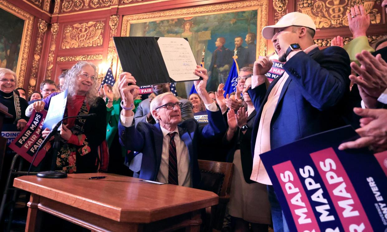 <span>Governor Tony Evers shows the new signed legislative maps on 19 February at the Capitol in Madison, Wisconsin.</span><span>Photograph: John Hart/AP</span>