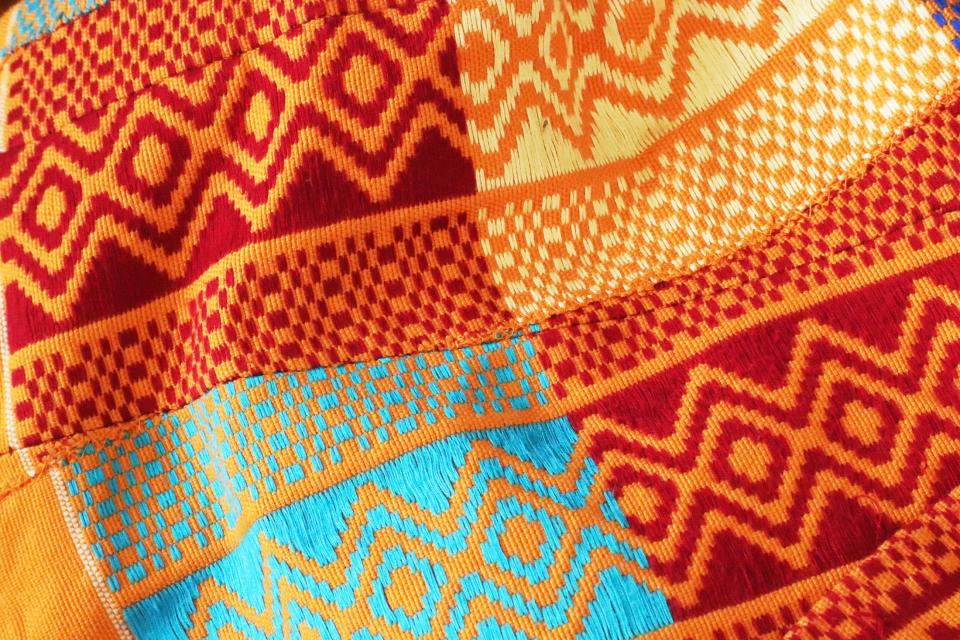 A close-up look at the hand-woven Kente cloth fabric used in clothing from the Fort Mosé 1738 fashion collection, offered by a company started by Daytona Beach native Maurice Gattis in partnership with a couple that he met on a vacation in Ghana.