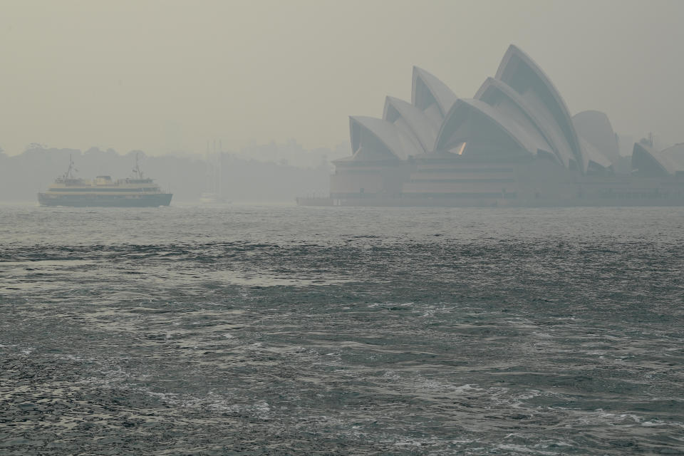 The Sydney Opera House can be seen as smoke haze from bushfires in New South Wales blankets the city. Source: AAP