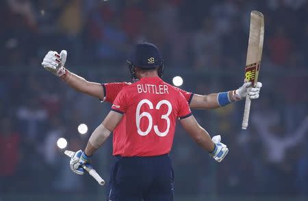 Cricket - England v New Zealand - World Twenty20 cricket tournament semi-final - New Delhi, India - 30/03/2016. England's Joe Root and Jos Buttler celebrate after winning their match. REUTERS/Adnan Abidi