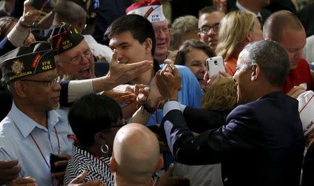 President Barack Obama shakes hands after speaking at the 116th National Convention of the Veterans of Foreign Wars in Pittsburgh, Pennsylvania July 21, 2015. REUTERS/Kevin Lamarque