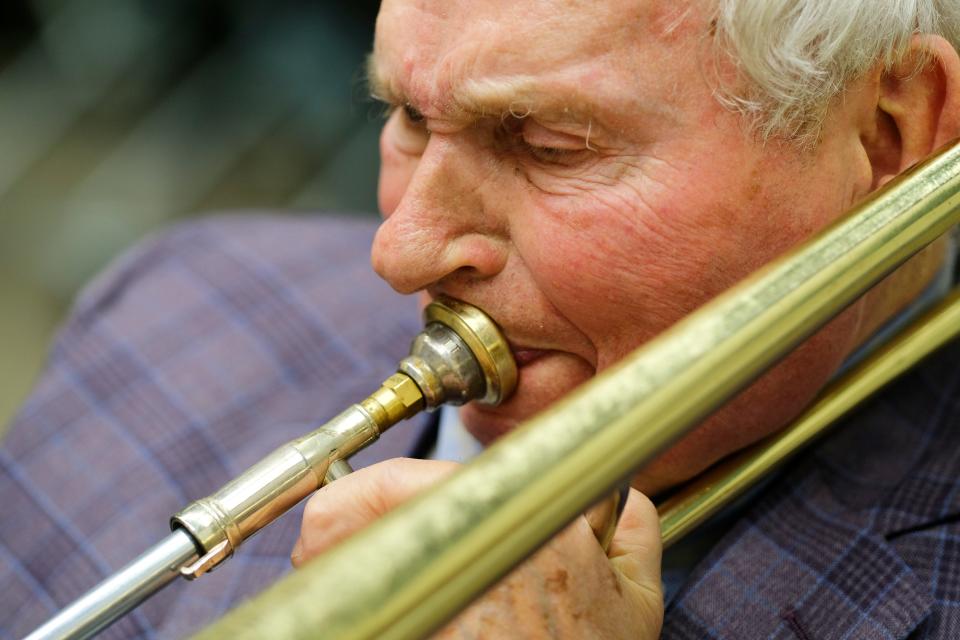 Longtime University of Oklahoma trombone professor Irvin Wagner rehearses in his office inside OU's Catlett Music Center in Norman on March 22, 2022.