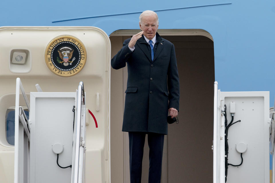 President Joe Biden salutes as he boards Air Force One for a trip to Kansas City, Mo., Wednesday, Dec. 8, 2021, at Andrews Air Force Base, Md. (AP Photo/Gemunu Amarasinghe)