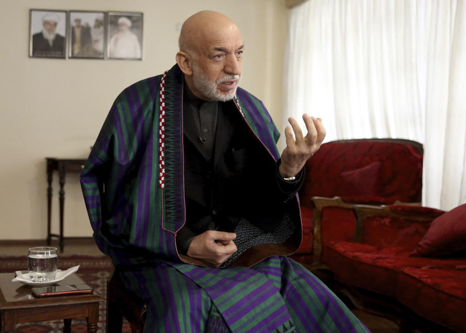 Former Afghan President Hamid Karzai speaks during an interview with The Associated Press in Kabul, Afghanistan, Friday, Feb. 28, 2020. On the eve of a potentially historic deal with the U.S. and the Taliban to end 18 years of war in Afghanistan, former Karzai welcomed the signing of the agreement, thanked Americans for their generosity, but had harsh words for the U.S. government and military. (AP Photo/Tamana Sarwary)