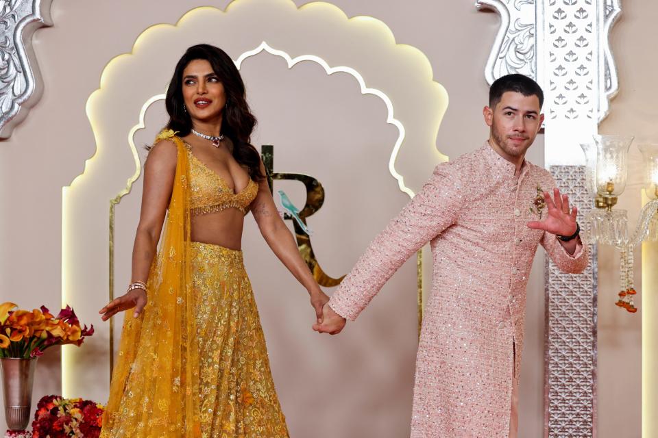 Nick Jonas and Priyanka Jonas (Chopra) hold hands at Ambani's wedding on July 12, 2024.