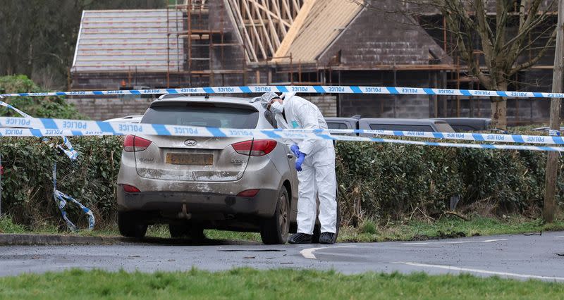 FILE PHOTO: Forensic officer from PSNI works at the Youth Sport Omagh sports complex where off-duty PSNI Detective Chief Inspector John Caldwell was shot