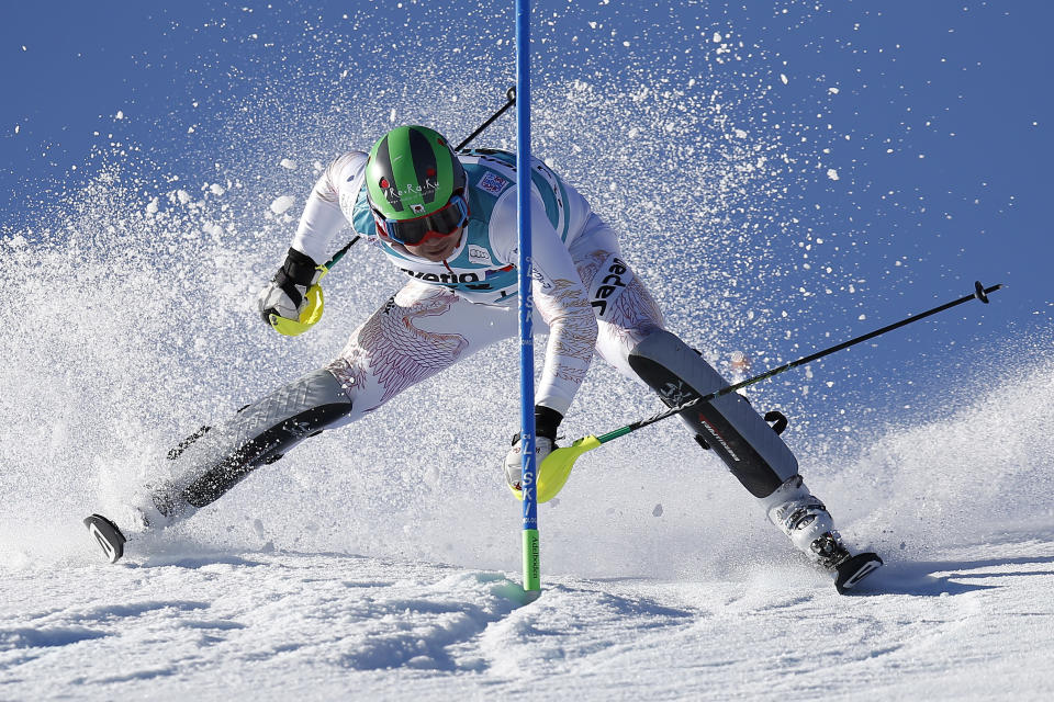 CORRECTS NAME TO SASAKI -Akira Sasaki of Japan in skis during the first run of the men's slalom FIS World Cup race in Adelboden, Switzerland, Sunday, Jan. 12, 2014. (AP Photo/Keystone,Peter Klaunzer)