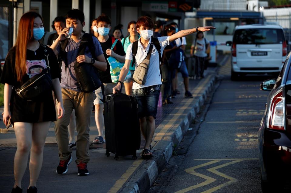 Despite thousands of Malaysians in Singapore waiting to return home, Ismail Sabri said only three person have crossed the border so far. — Reuters pic