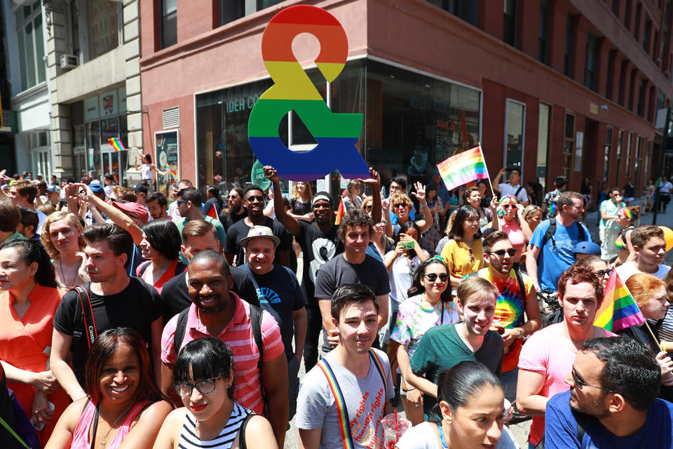 <p>A woman holds a rainbow question sign during the N.Y.C. Pride Parade in New York on June 25, 2017. (Photo: Gordon Donovan/Yahoo News) </p>