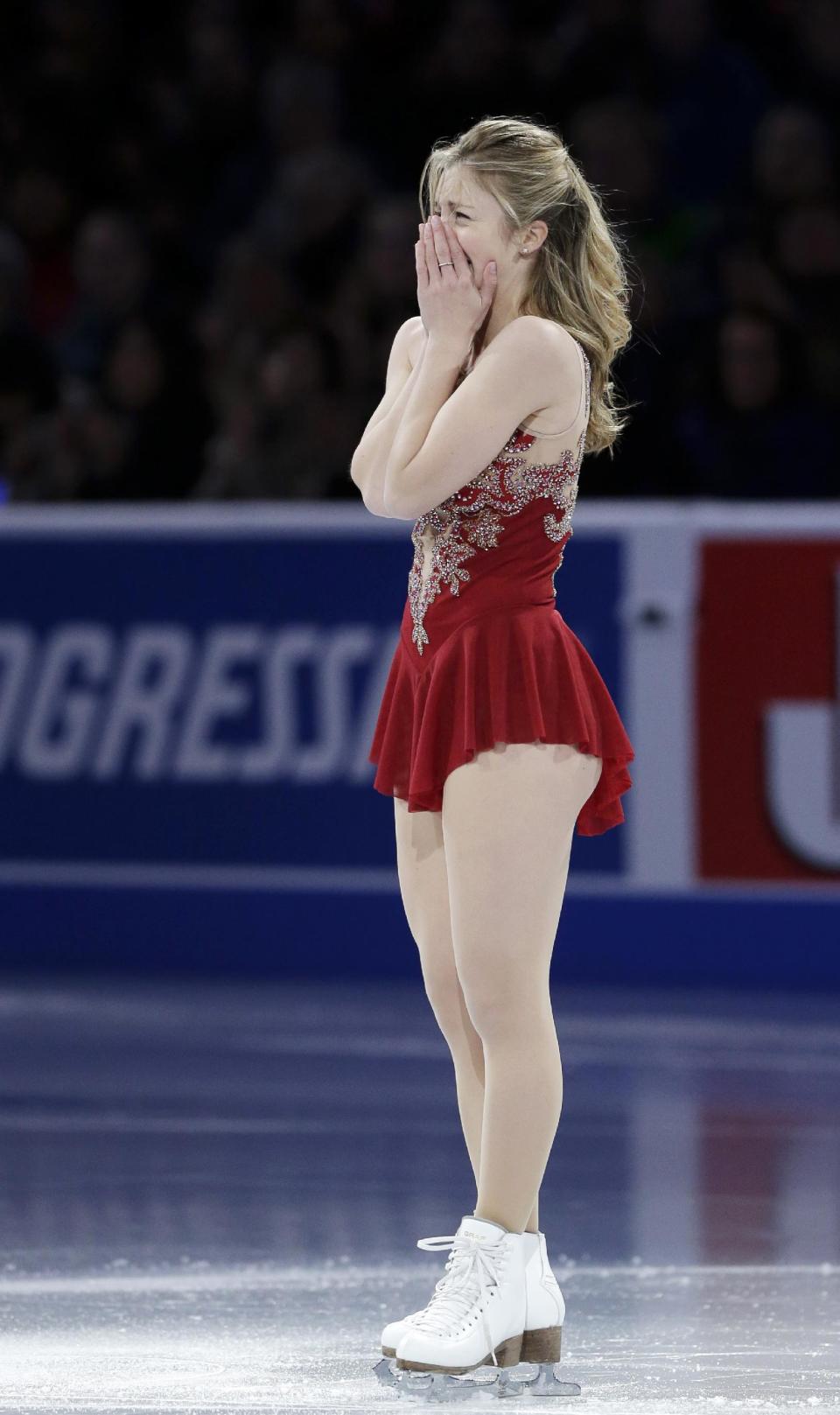 Ashley Wagner becomes emotional at mid-ice after her performance during the skating spectacular after the U.S. Figure Skating Championships in Boston, Sunday, Jan. 12, 2014. Women's third finisher Mirai Nagasu, the only one of the top four finishers with Olympic experience, was bumped in favor of Wagner when U.S. Figure Skating announced the selections earlier Sunday. (AP Photo/Steven Senne)
