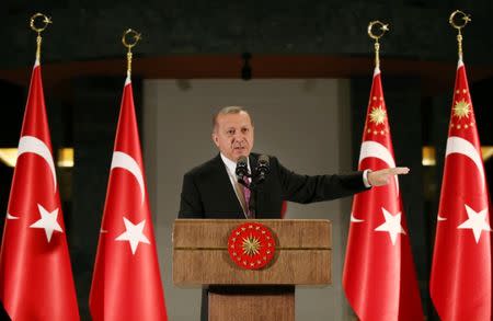 Turkish President Tayyip Erdogan makes a speech during a fast-breaking iftar dinner at the Presidential Palace in Ankara, Turkey, June 20, 2017. Picture taken June 20, 2017. Yasin Bulbul/Presidential Palace/Handout via REUTERS