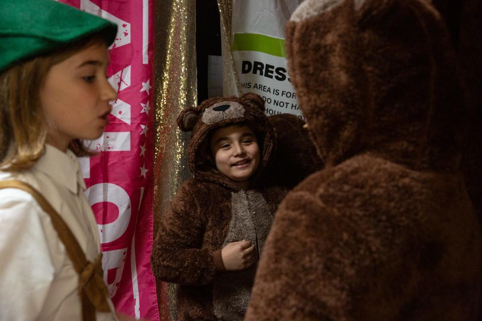 Third grade student Matthew Suarez, playing Baby Bear, speaks with fellow bear actor Amelia McAlister and Pinocchio, played by Jace Roberts, during dress rehearsals at Metro Elementary on Thursday, March, 21, 2024, in Corpus Christi, Texas.