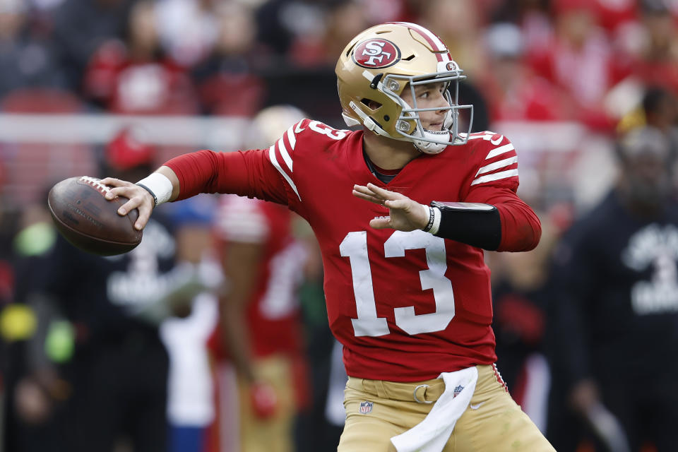 San Francisco 49ers quarterback Brock Purdy (13) passes against the Arizona Cardinals during the second half of an NFL football game in Santa Clara, Calif., Sunday, Jan. 8, 2023. (AP Photo/Jed Jacobsohn)