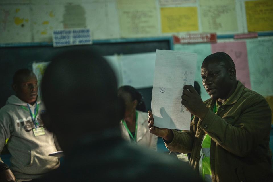 <p>Electoral Commission officials count ballots at a polling station on Aug. 8, 2017 in Nairobi, Kenya. (Photo: Tony Karumba/AFP/Getty Images) </p>