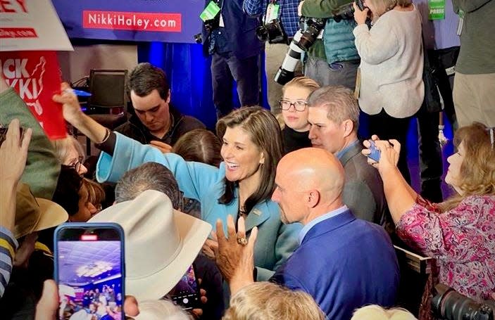 Nikki Haley signs signs for supporters after a rally in Richmond, Virginia, on Thursday.