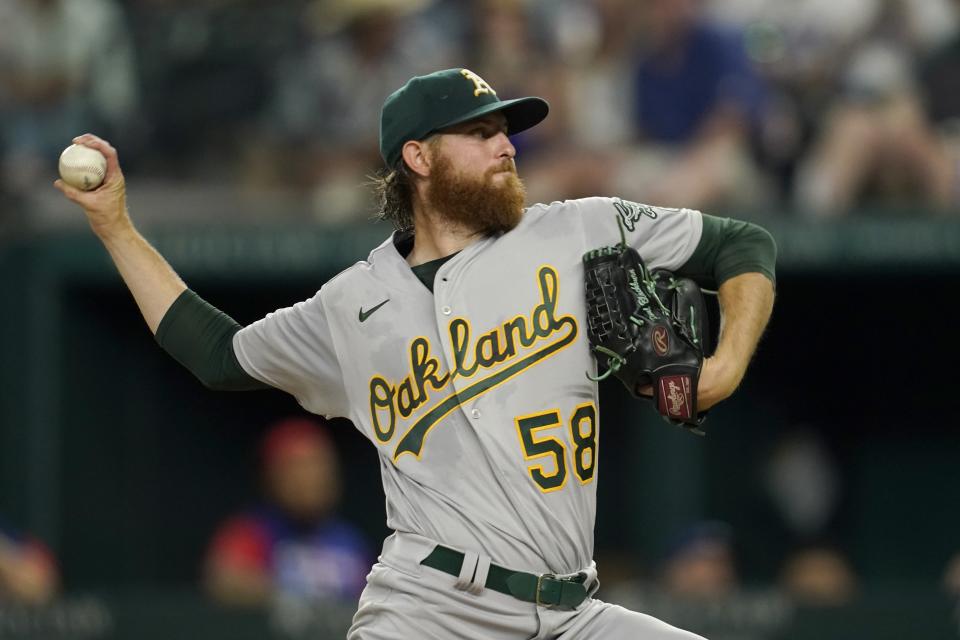 Oakland Athletics starting pitcher Paul Blackburn throws to the Texas Rangers in the fourth inning of a baseball game, Wednesday, July 13, 2022, in Arlington, Texas. (AP Photo/Tony Gutierrez)