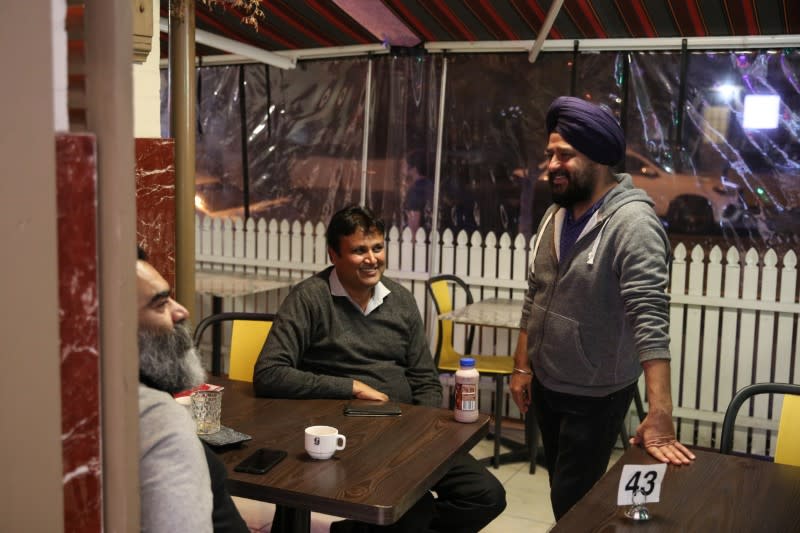 Small business owners visit an Indian restaurant, amidst the easing of the coronavirus disease (COVID-19) restrictions, in Sydney