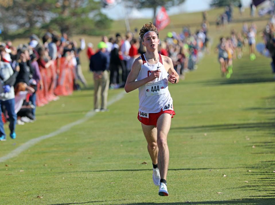 Iowa City, City High senior Ford Washburn (444) finishes second during the State Cross Country Class 4A Boys 5K race at the Lakeside Municipal Golf Course in Fort Dodge. 