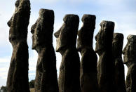 FILE PHOTO: A view of "Moai" statues in Ahu Akivi, on Easter Island, 4,000 km (2,486 miles) west of Santiago, in this photo taken Oct. 31, 2003. Easter Island's mysterious "Moai", giant head statues carved out of volcanic rock, are in danger of being destroyed by years of tropical rains and wind as well as careless humans and farms animals. Experts have called on the international community to commit funds to preserve the monoliths, whose mystery draws tourists to the world's most remote inhabited island. REUTERS/Carlos Barria