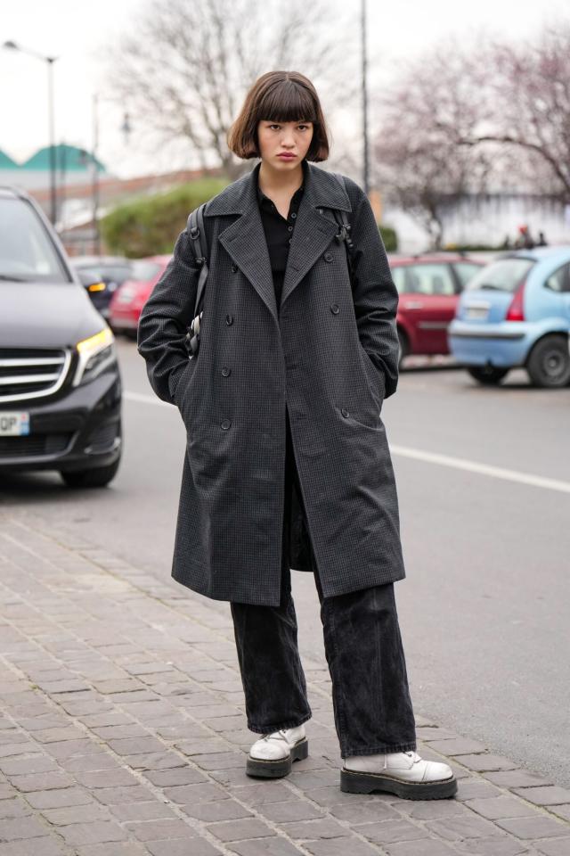 Combining white Dr. Martens with a trench coat