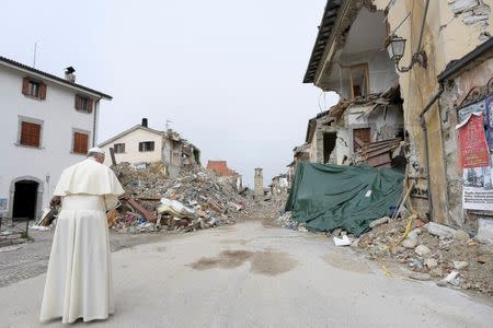 Pope Francis prays in Amatrice, Italy, October 4, 2016. REUTERS/Osservatore Romano/Handout via Reuters