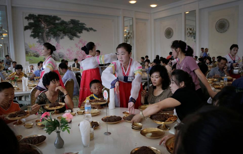 People dine at the Ongnyugwan, a popular noodle restaurant in Pyongyang, North Korea, on Sept. 1, 2014. The restaurant, built in 1960 at the instructions of the late leader Kim Il Sung, claims to serve 10,000 lunches a day.